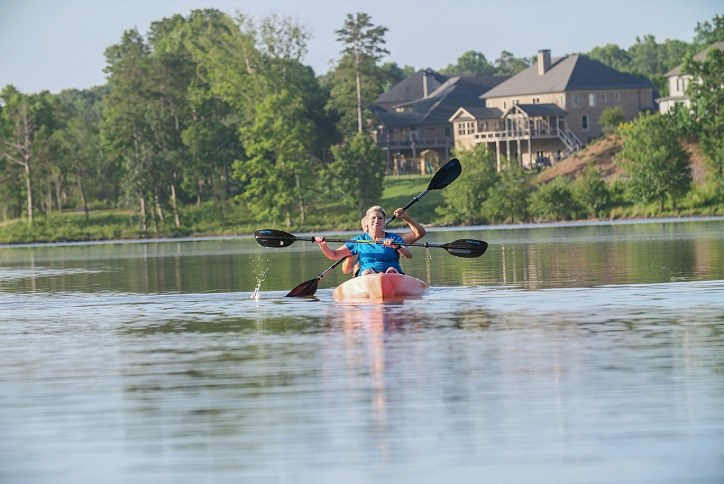 Couple kayaking on lake at Sterling on the Lake