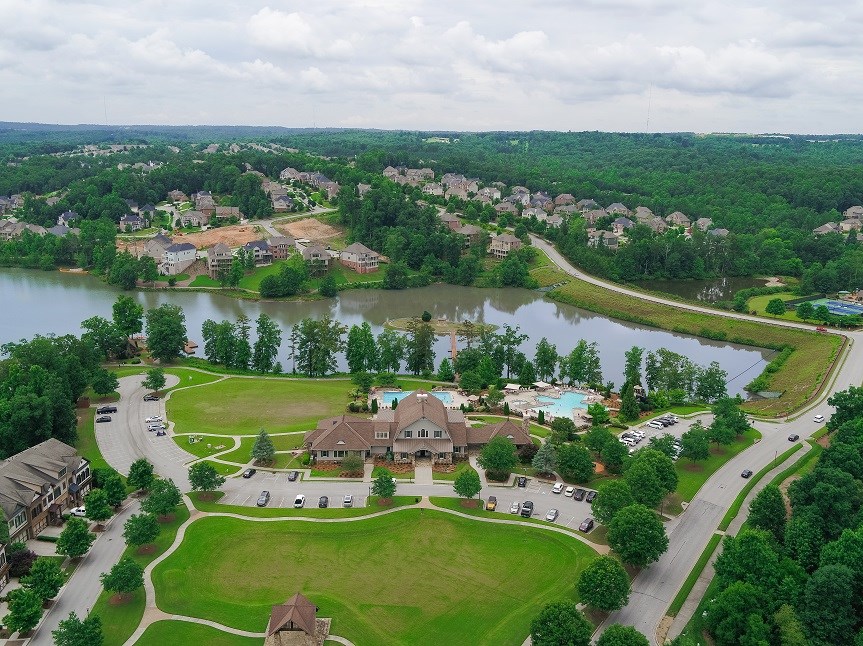 Drone shot of the clubhouse and lake at Sterling on the Lake