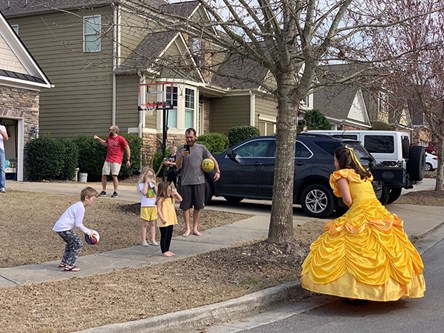 Woman dressed as Belle, visiting kids in Sterling on the Lake.