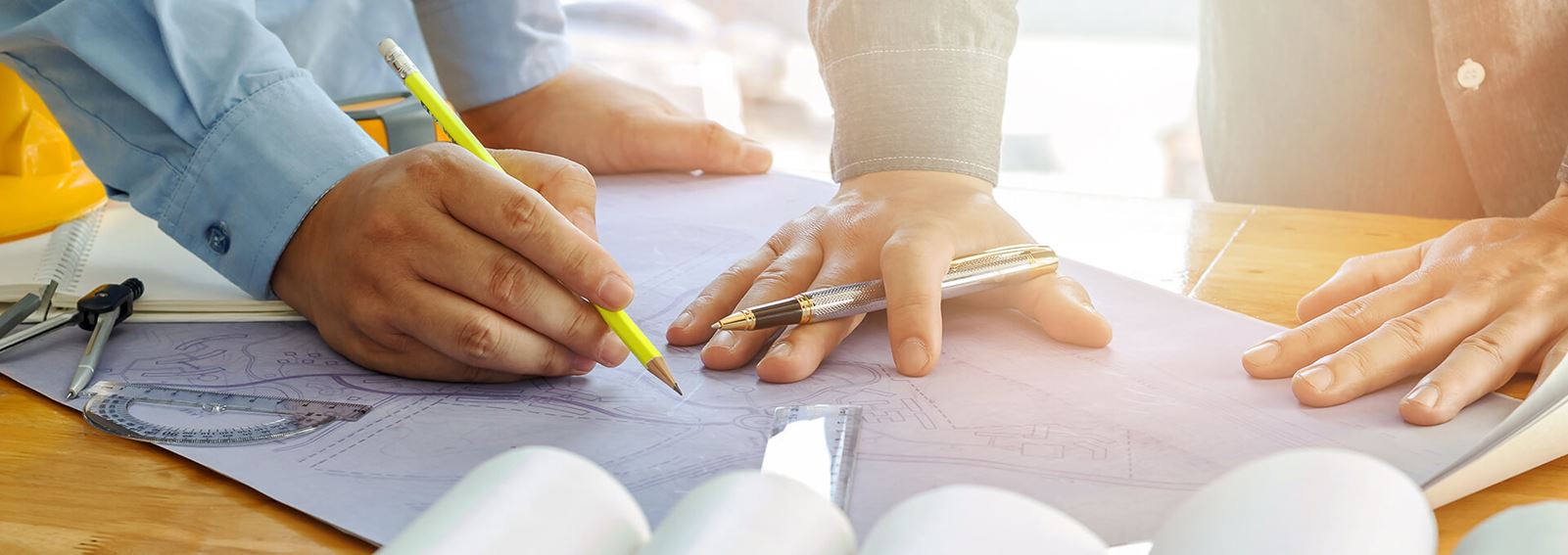 People viewing blue print plans