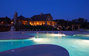 Sterling on the Lake's Clubhouse and zero entry pool at night