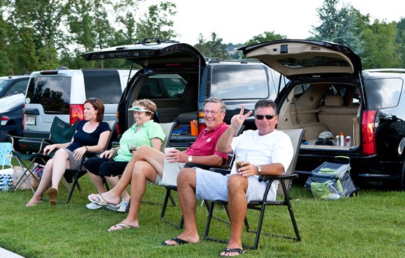 Residents hanging out on the Village Green enjoying the Fly Betty Concert