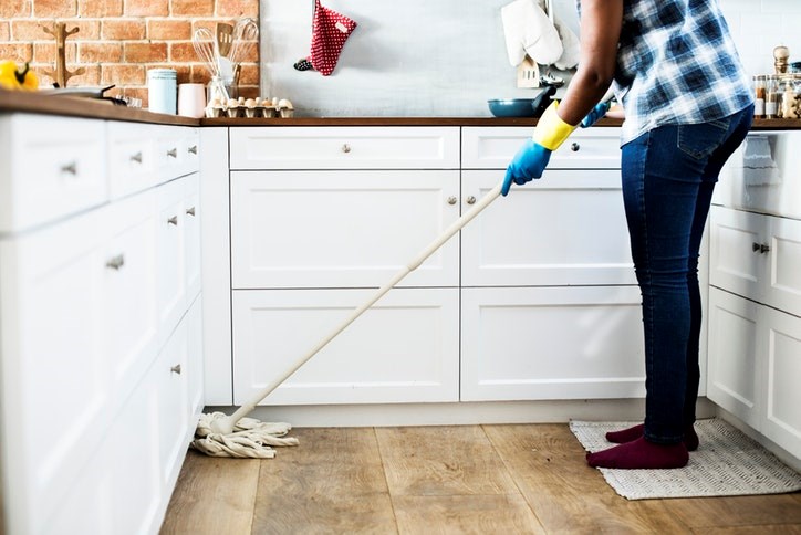 Person mopping floors - Sterling on the Lake