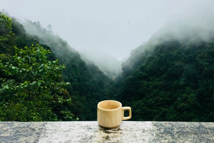 Mountains with coffee cup
