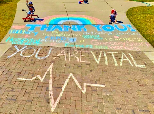 Sidewalk chalk drawings and sayings in Sterling on the Lake.