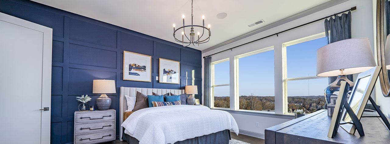 Meadowhill by David Weekley Homes model home primary bedroom.