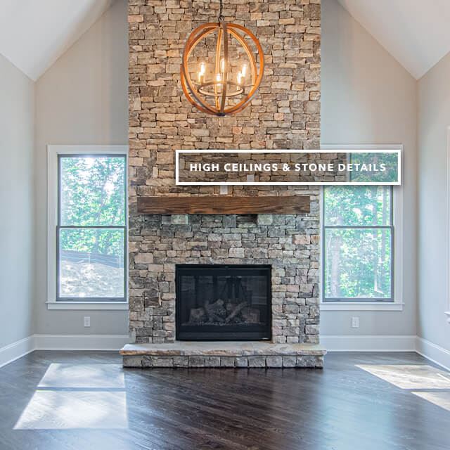 High ceilings and stone details on fireplace