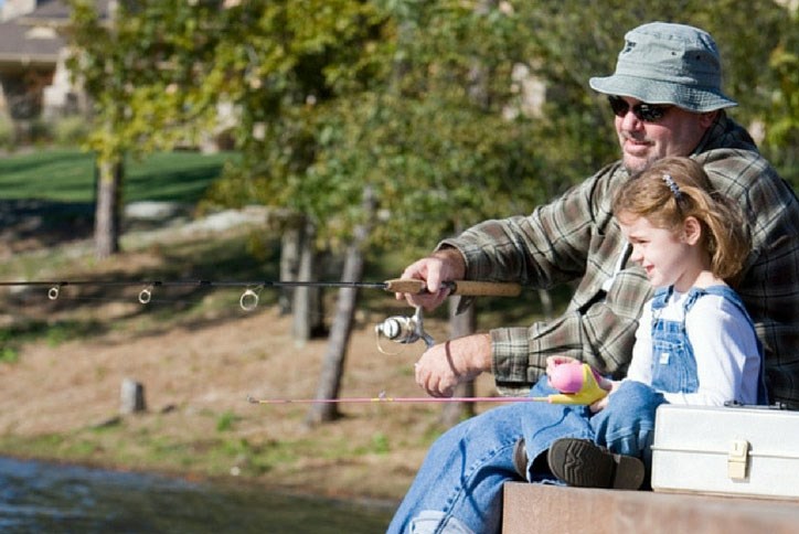 Dad and daughter enjoying fishing outing at Sterling on the Lake