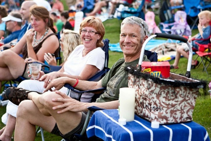 Couple enjoying outdoor concert at Sterling on the Lake.