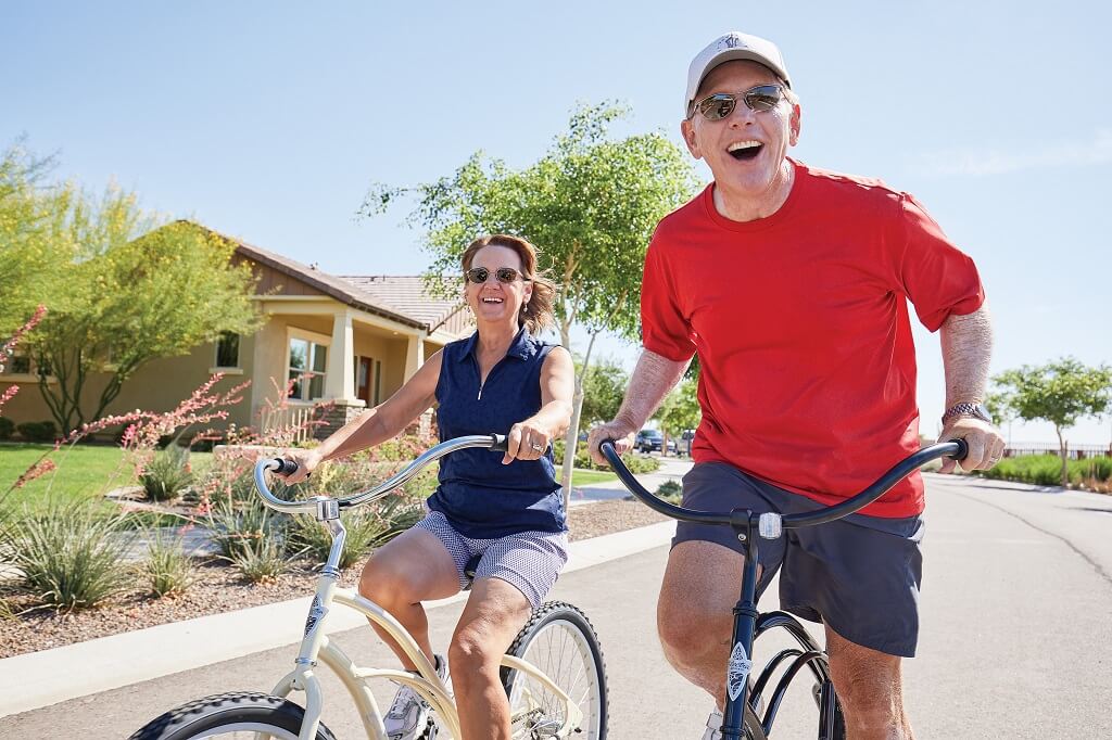 Active Adult Couple Riding Bikes